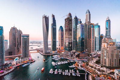 Panoramic view of modern buildings in city against sky