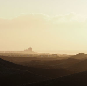 Scenic view of landscape against sky during sunset