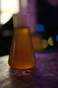 Close-up of orange juice on table