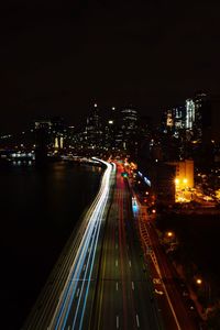 High angle view of light trails on road at night