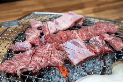 Close-up of meat on barbecue grill