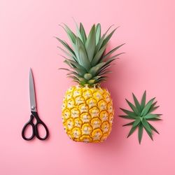 Close-up of pineapple against yellow background