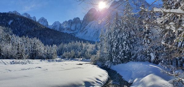 Scenic view of snow covered mountains against sky