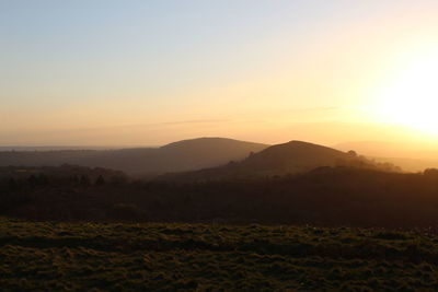 Scenic view of landscape against sky during sunset