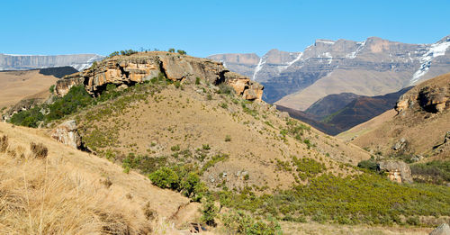 Panoramic view of landscape and mountains against clear sky