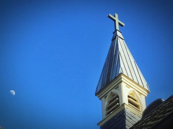 Low angle view of built structure against clear blue sky