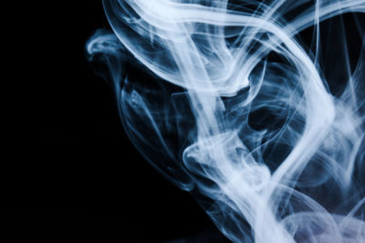 Close-up of smoke against black background