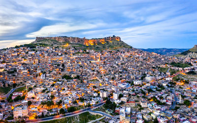 High angle view of townscape against cloudy sky