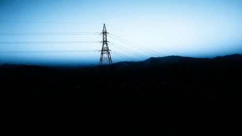 Electricity pylons on landscape