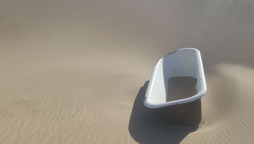 High angle view of camera on sand