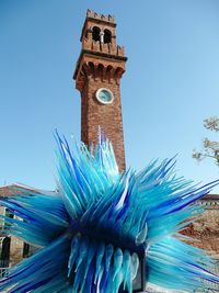 Low angle view of tower against clear blue sky