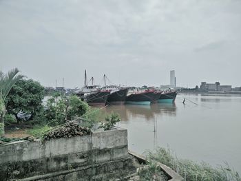 Calm sea with buildings in background