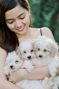 Portrait of young woman with dog