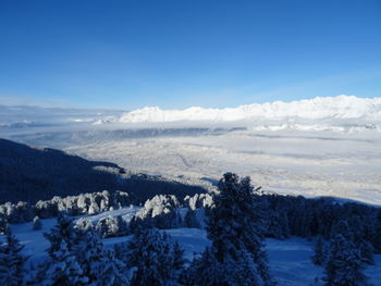 Scenic view of snowcapped mountains against sky