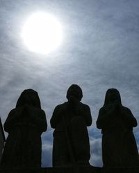 Low angle view of statue against sky