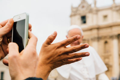 Close-up of hands holding smart phone