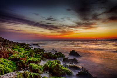 Scenic view of sea against dramatic sky