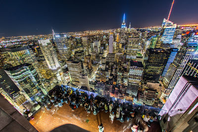 High angle view of illuminated buildings in city at night