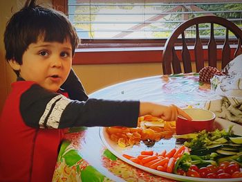 Cute boy having food