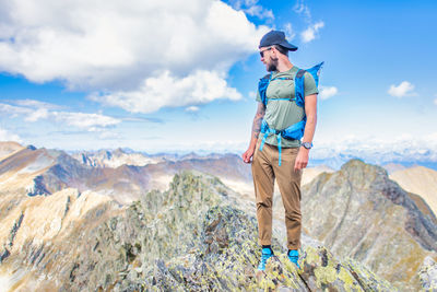 Man on top of mountains in the italian alps