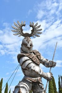 Low angle view of statue against sky