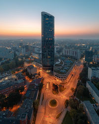 High angle view of illuminated cityscape against sky at night