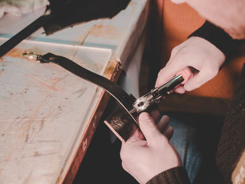 Midsection of person working on cutting board