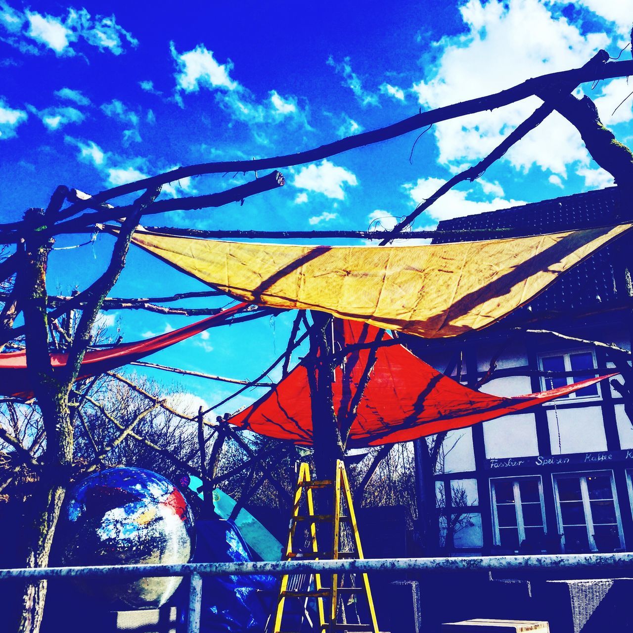 sky, low angle view, day, outdoors, no people, tree, cloud - sky, amusement park, nature