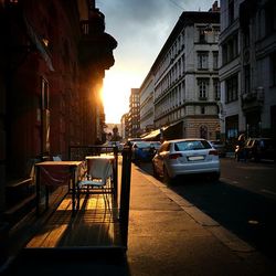 Buildings in city at sunset