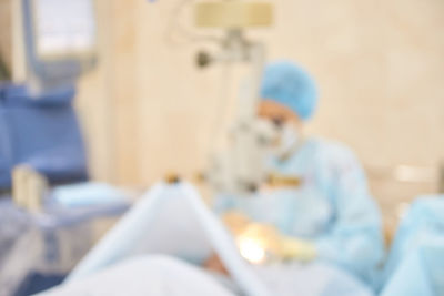 Side view of man working on bed