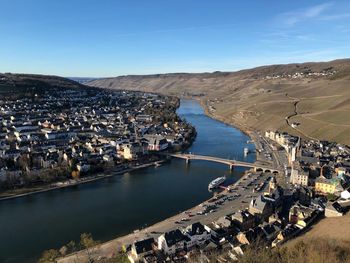 High angle view of river and buildings in city