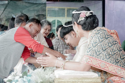 Group of people looking at traditional clothing