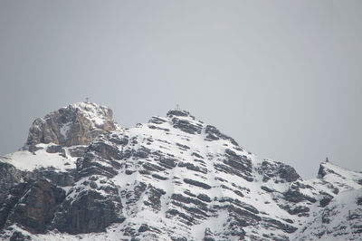 Scenic view of snowcapped mountains against clear sky