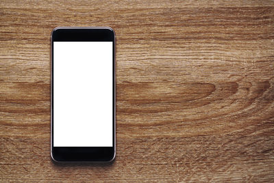 Directly above view of smart phone on table