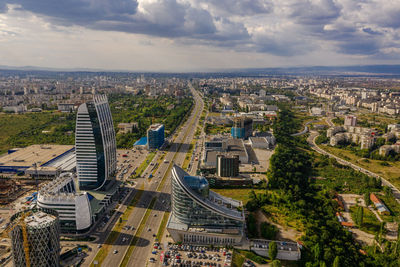 High angle view of buildings in city against sky