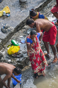 High angle view of people enjoying in water