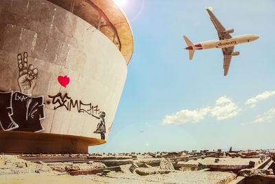 Low angle view of airplane against sky