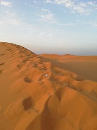 Scenic view of desert against sky