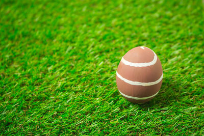 Close-up of tea light on field