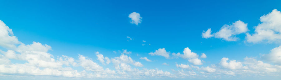 Panoramic view of sea against blue sky