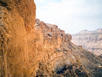 Rock formations on landscape against sky