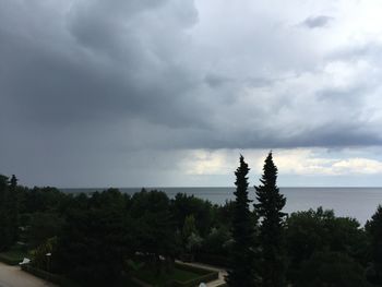 Scenic view of sea against cloudy sky