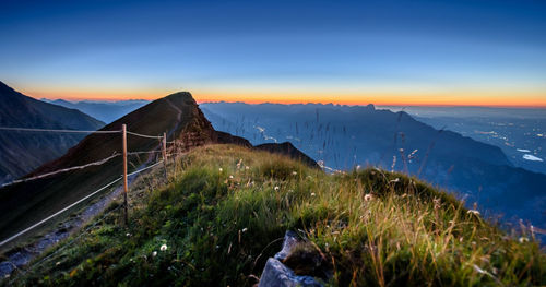 Scenic view of mountains against sky at night