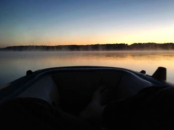 Scenic view of lake at sunset