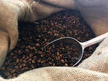 Close-up of roasted coffee beans in sack