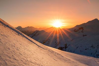 Scenic view of mountains against sky during sunset