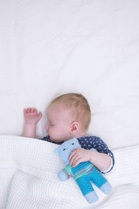 Cute baby sleeping in bed