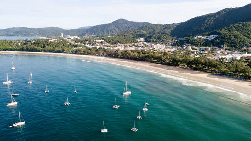 High angle view of sea by mountains