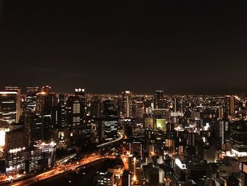 High angle view of illuminated city buildings at night