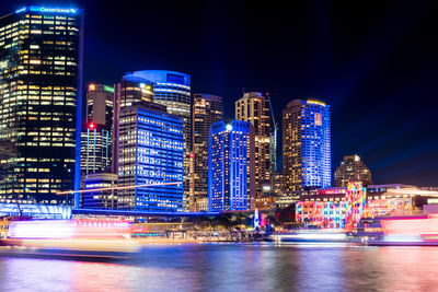 Illuminated city buildings at night